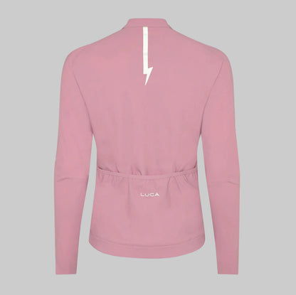 Back-view-of-a-dusty-pink-long-sleeve-cycling-jersey-with-the-white-LUCA-logo-and-a-reflective- lightning-bolt-strip-along-the-neck