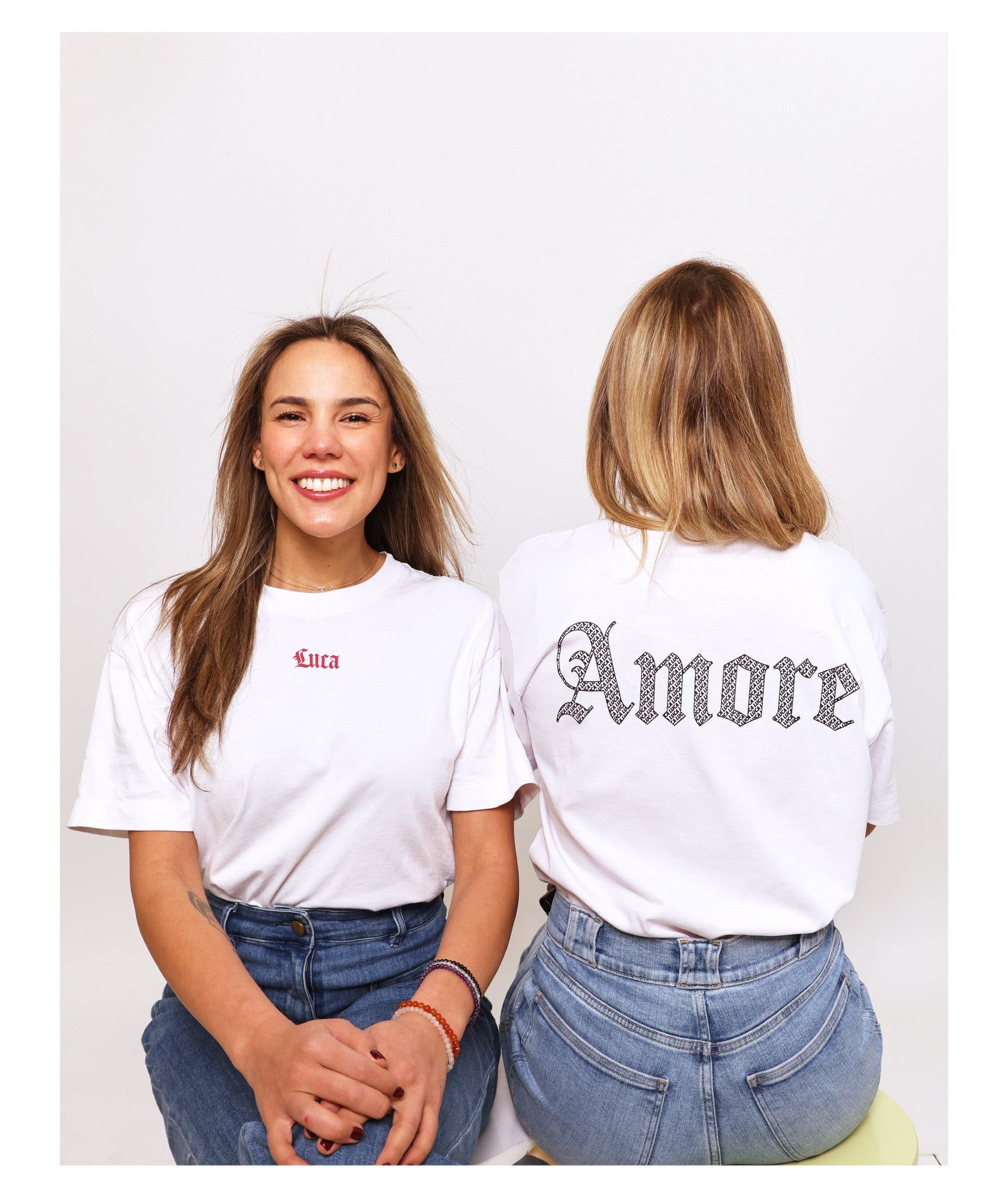 Lifestyle-photo-featuring-the-Luca- and-Amore-graphic-t-shirt-collection-worn-by-two-women