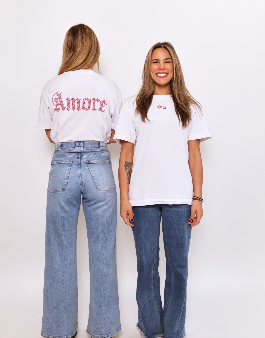 Lifestyle-shot-of-the-Luca-t-shirt- collection-highlighting-the-"Luca"- front-print-and-the-"Amore"-back- print-on-two-different-models