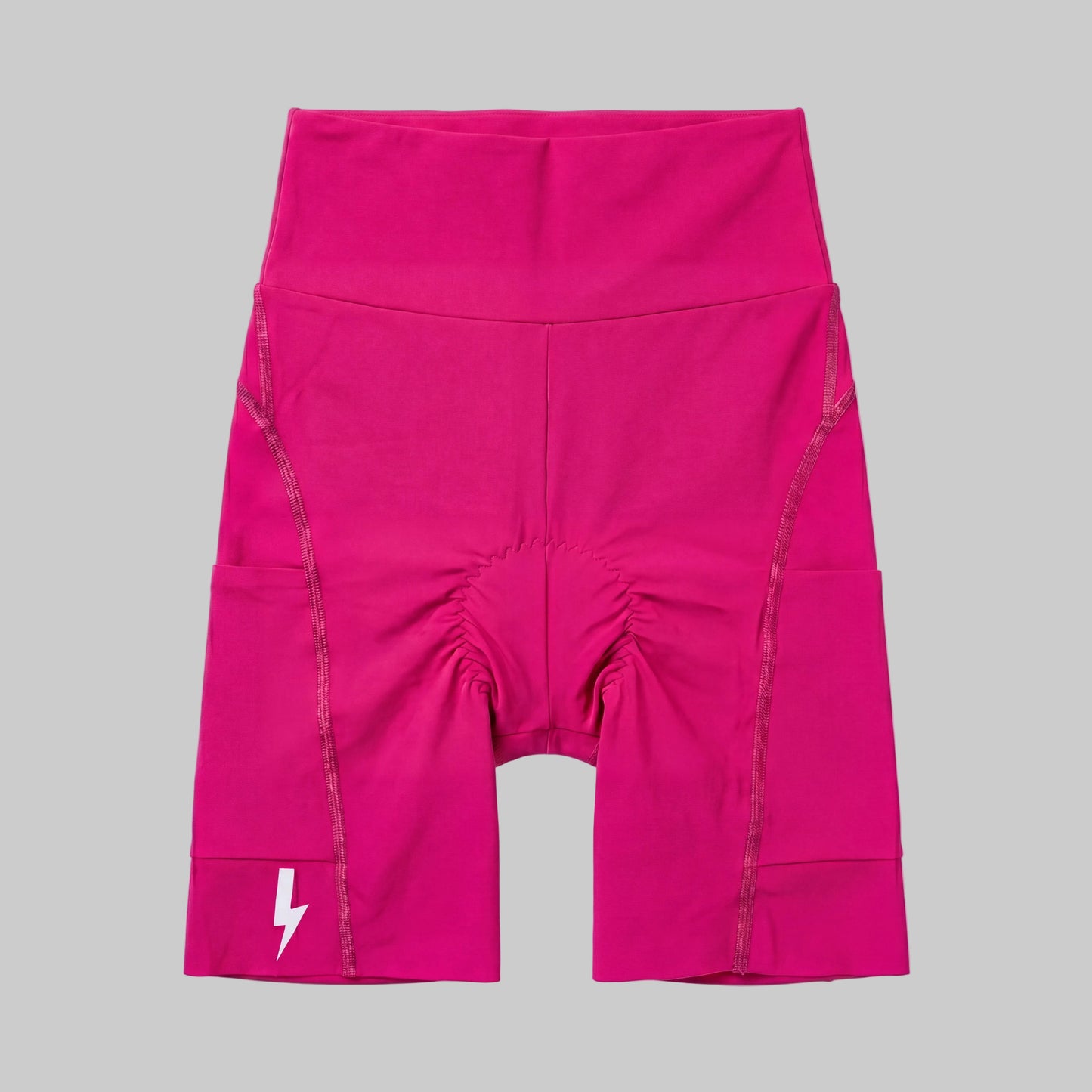 LUCA Empower women's high-waisted cycling shorts in hibiscus, front flat lay with chamois detail