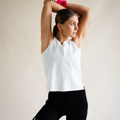 Cyclist in LUCA Meander vest in white, arms raised showing relaxed fit