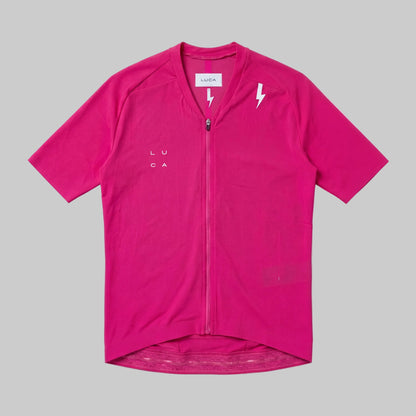 LUCA Soleil women's cycling jersey in hibiscus - front flat lay with V-neckline and bolt detail