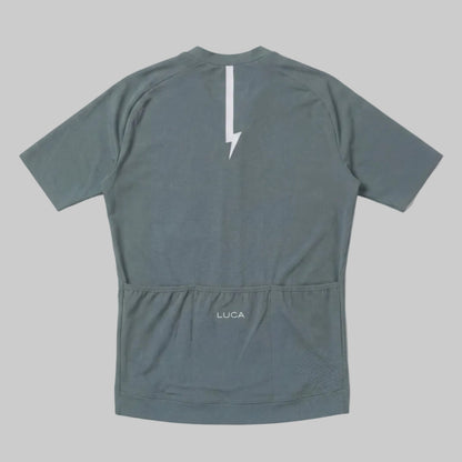 LUCA Soleil women's cycling jersey in matcha - back view with reflective bolt and pocket detail