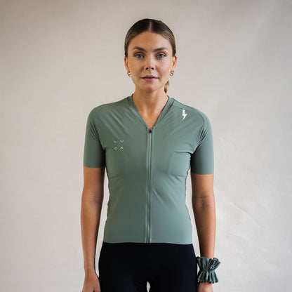 Cyclist wearing LUCA Soleil jersey in matcha, front view